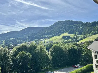 a view of a valley with trees and a house at Studio avec Piscine Chauffée, Tennis & Balcon - 4 Couchages à Megève - FR-1-597-14 in Megève