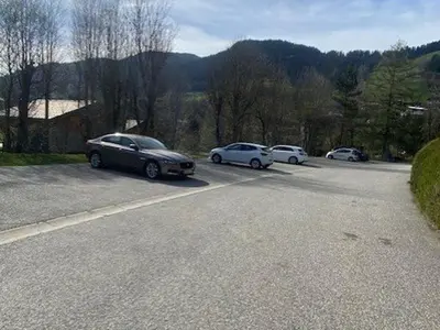 a group of cars parked in a parking lot at Studio avec Piscine Chauffée, Tennis & Balcon - 4 Couchages à Megève - FR-1-597-14 in Megève