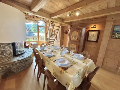 a dining room with a table and a fireplace at Appartement Duplex 2 pièces, 4 couchages, proche pistes de ski, garage, Demi-Quartier - FR-1-597-16 in Demi-Quartier