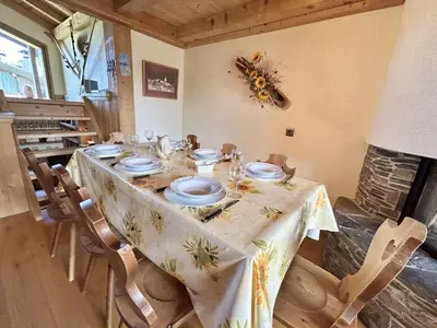 a dining room table with a table cloth on it at Appartement Duplex 2 pièces, 4 couchages, proche pistes de ski, garage, Demi-Quartier - FR-1-597-16 in Demi-Quartier