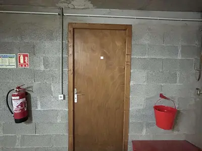 a fire hydrant next to a door with a fire bucket at Studio Alcôve Cosy, 4 Pers, Jardin, Parking, Proche Télécabine et Golf - Megève - FR-1-597-21 in Megève