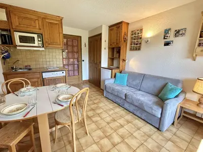 a living room with a couch and a table at Studio Alcôve Cosy, 4 Pers, Jardin, Parking, Proche Télécabine et Golf - Megève - FR-1-597-21 in Megève