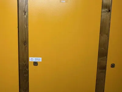 a yellow door with a sign on it at Studio Alcôve Cosy, 4 Pers, Jardin, Parking, Proche Télécabine et Golf - Megève - FR-1-597-21 in Megève