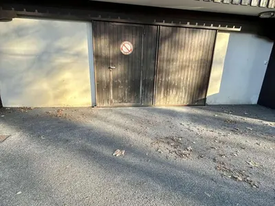 a metal garage door with a no entry sign at Appartement cosy à Megève: 3 pièces + mezzanine, 4 couchages - Proche remontées mécaniques et golf - FR-1-597-19 in Megève