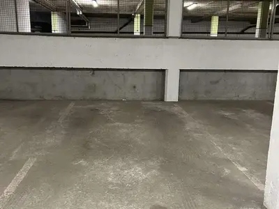 an empty parking lot in a large building at Appartement cosy 2 pièces avec balcon, proche centre et télécabine, piscine et tennis en été - FR-1-597-20 in Megève