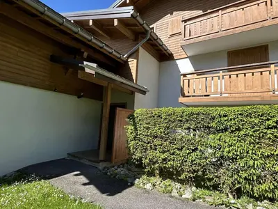 a view of a garden with bushes and trees at Charmant T2 à Demi-Quartier, 1 chambre, balcon, parking, casier à skis, proche forêt et espaces verts - FR-1-597-32 in Demi-Quartier