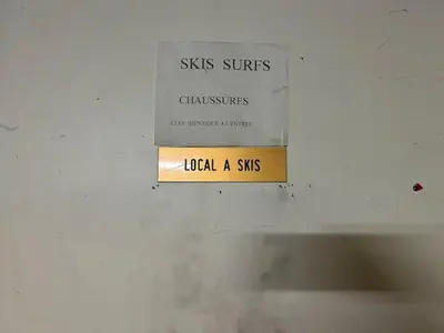 a sign on a ceiling that sayskisssurfsiddleslocal a sins at Studios + Cabine à Megève, 4 Couchages, 500m des Remontées, Balcon Sud, Parking Inclus - FR-1-597-34 in Megève