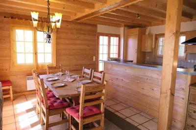 a dining room with a table in a cabin at Chalet Granier - Chalet Granier MAE-5234 in Saint-Gervais-les-Bains