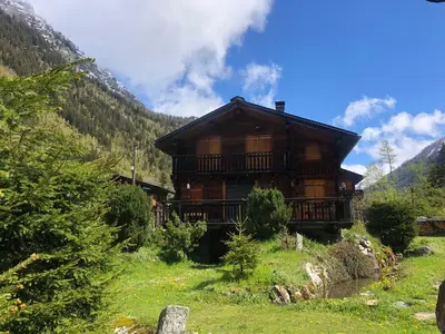 a log cabin on a hill in the mountains at Chalet Orval - Chamonix Argentière in Chamonix-Mont-Blanc