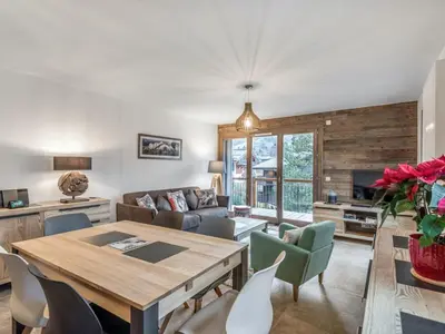 a living room with a wooden table and chairs at DIFY Appartement Luxe - Saint Gervais in Saint-Gervais-les-Bains