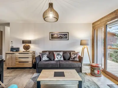 a living room with a couch and a table at DIFY Appartement Luxe - Saint Gervais in Saint-Gervais-les-Bains