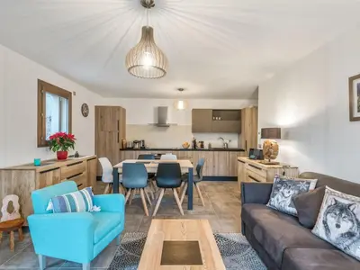 a living room with a couch and a table at DIFY Appartement Luxe - Saint Gervais in Saint-Gervais-les-Bains