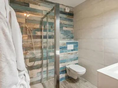 a bathroom with a toilet and a shower at DIFY Appartement Luxe - Saint Gervais in Saint-Gervais-les-Bains