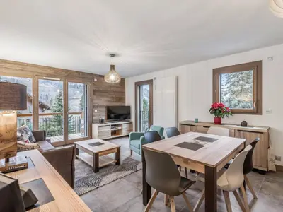 a living room with a table and chairs at DIFY Appartement Luxe - Saint Gervais in Saint-Gervais-les-Bains
