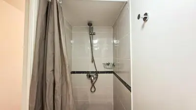 a shower with a shower curtain in a bathroom at Résidence Les Pleiades - Appartement spacieux avec balcon · Centre station · Parking couvert MAE-7352 in Flaine