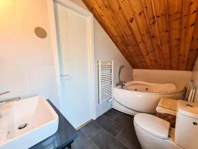 a bathroom with a sink and a toilet and a tub at Résidence Hameau - Chalet lumineux · Poêle à bois · WIFI gratuit et illimité · Garage MAE-7353 in Flaine