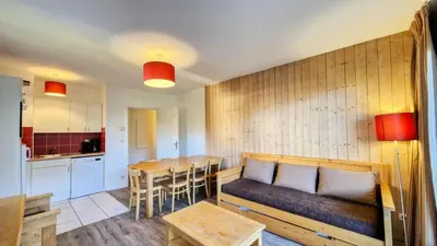 a living room with a couch and a table at Résidence Les Pleiades - Appartement spacieux · Centre station · Balcon · Parking couvert MAE-7356 in Flaine