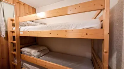 a couple of bunk beds in a room at Résidence Arche - Appartement confortable · Centre station · Terrasse MAE-7360 in Flaine