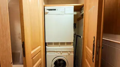 a washer and dryer in a tiny house at Résidence Arche - Appartement confortable · Centre station · Terrasse MAE-7360 in Flaine