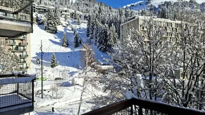 a view of a snow covered mountain with buildings and trees at Résidence Betelgeuse - Appartement rénové · Proche des pistes et des commerces · Balcon MAE-7361 in Flaine