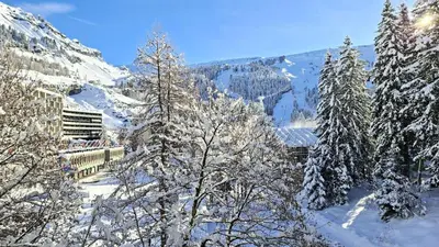a snowy mountain with snow covered trees and mountains at Résidence Betelgeuse - Appartement rénové · Proche des pistes et des commerces · Balcon MAE-7361 in Flaine