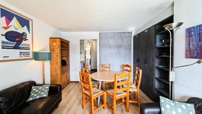 a living room with a couch and a table at Résidence Doris - Appartement rénové · Centre station · Balcon MAE-7363 in Flaine