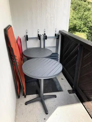 a table and chairs sitting on a balcony at Résidence Doris - Appartement rénové · Centre station · Balcon MAE-7363 in Flaine