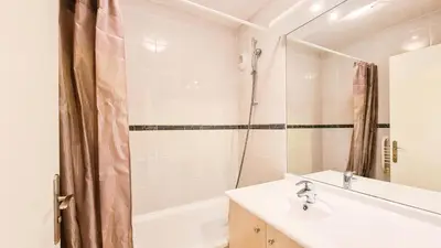 a bathroom with a sink and a tub and a shower at Résidence Les Pleiades - Appartement confortable · Centre station · Balcon MAE-7365 in Flaine