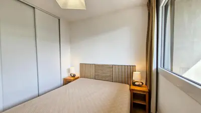 a bedroom with a bed and a window at Résidence Les Pleiades - Appartement confortable · Centre station · Balcon MAE-7365 in Flaine