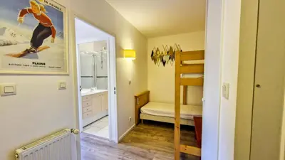 a small room with a bathroom with a sink and a mirror at Résidence Les Pleiades - Appartement confortable avec cabine · Centre station · Balcon · Parking couvert MAE-7366 in Flaine