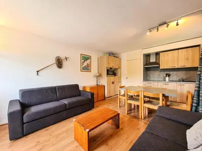 a living room with a couch and a table at Résidence Gemeaux - Appartement confortable · Centre station · Balcon MAE-7369 in Flaine