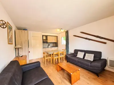 a living room with a couch and a table at Résidence Gemeaux - Appartement confortable · Centre station · Balcon MAE-7369 in Flaine