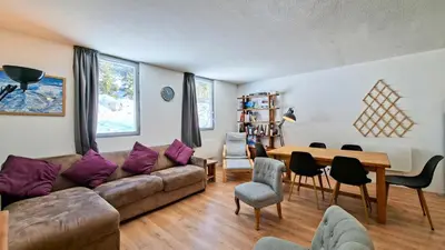 a living room with a couch and a table at Résidence La Petite Ourse - Appartement neuf · Centre station MAE-7370 in Flaine