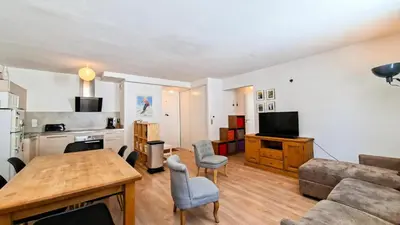 a bedroom with a large bed and a television at Résidence La Petite Ourse - Appartement neuf · Centre station MAE-7370 in Flaine