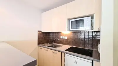 a kitchen with a sink and a microwave at Residence De La Foret - Appartement confortable · Proche des pistes · Casier à ski MAE-7372 in Flaine