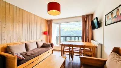 a living room with a couch and a table at Résidence Les Pleiades - Appartement lumineux · Centre station · Balcon · Parking couvert MAE-7373 in Flaine
