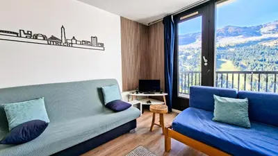a living room with a couch and a large window at Résidence Belier - Appartement confortable · Au pied des pistes · WIFI gratuit et illimité · Terrasse MAE-7374 in Flaine