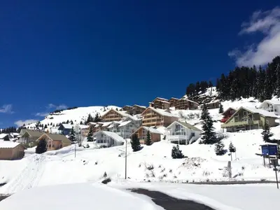 a group of houses on a snow covered mountain at Résidence Chateaux De Crans - Appartement confortable · Balcon MAE-7375 in Flaine