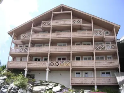 a large building with balconies on the side of it at Résidence Chateaux De Crans - Appartement confortable · Balcon MAE-7375 in Flaine