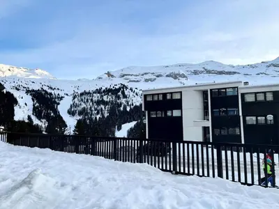 a building on top of a snow covered mountain at Résidence Les Terrasses De Veret - Appartement confortable · Au pied des pistes · Piscine · Spa · Parking MAE-7377 in Flaine