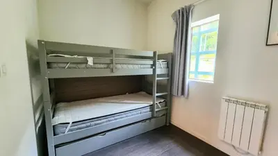 a room with two bunk beds with a window at Résidence Les Terrasses De Veret - Appartement confortable · Au pied des pistes · Piscine · Spa · Parking MAE-7377 in Flaine