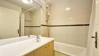 a bathroom with a sink and a bathtub and a sink at Résidence Les Pleiades - Appartement lumineux avec balcon · Centre station · Parking couvert MAE-7379 in Flaine