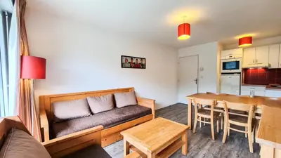 a living room with a couch and a table at Résidence Les Pleiades - Appartement spacieux · Centre station · Parking couvert · Balcon MAE-7381 in Flaine