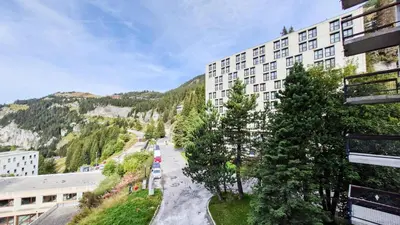 arial view of a building with trees and a street at Résidence Betelgeuse - Appartement rénové · Entre pistes et commerces · Balcon MAE-7382 in Flaine