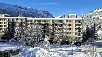 a large building in the snow with snow covered trees at Résidence Betelgeuse - Appartement rénové · Entre pistes et commerces · Balcon MAE-7382 in Flaine