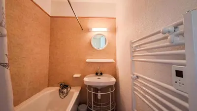 a bathroom with a sink and a toilet and a mirror at Résidence Sagittaire - Studio confortable avec balcon · Centre station MAE-7388 in Flaine