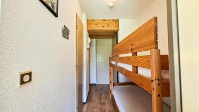 a small room with a bunk bed in a house at Résidence Sagittaire - Studio confortable avec balcon · Centre station MAE-7388 in Flaine