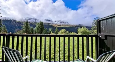 a balcony with chairs and a view of a mountain at Résidence Sagittaire - Studio confortable avec balcon · Centre station MAE-7388 in Flaine