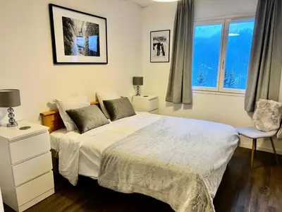 a view of a valley with trees and mountains at Résidence Les Pleiades - Appartement lumineux · Centre station · Balcon MAE-7393 in Flaine
