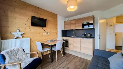 a view of a balcony with a table and chairs at Résidence Les Pleiades - Appartement lumineux · Centre station · Balcon MAE-7393 in Flaine